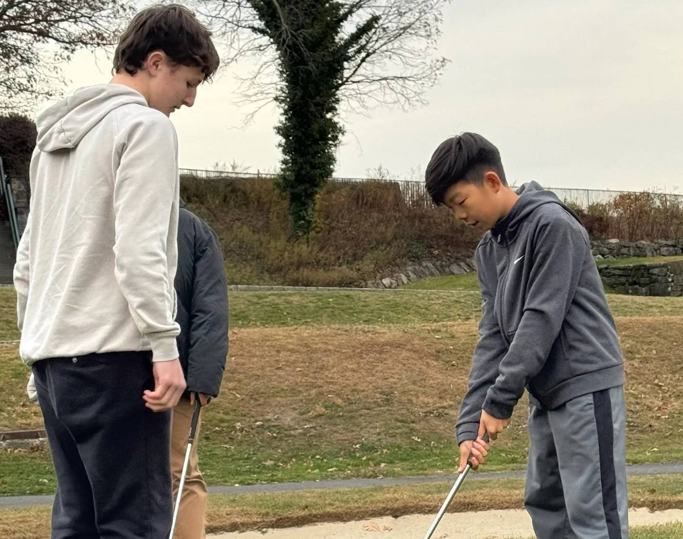 Students practicing bunker shots